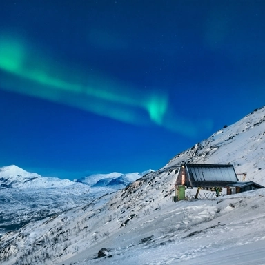 Ski Lodge under Aurora Borealis